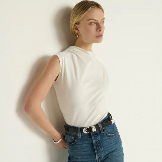 A woman wearing the off-white Lulu Mock Neck Top by Nation LTD
