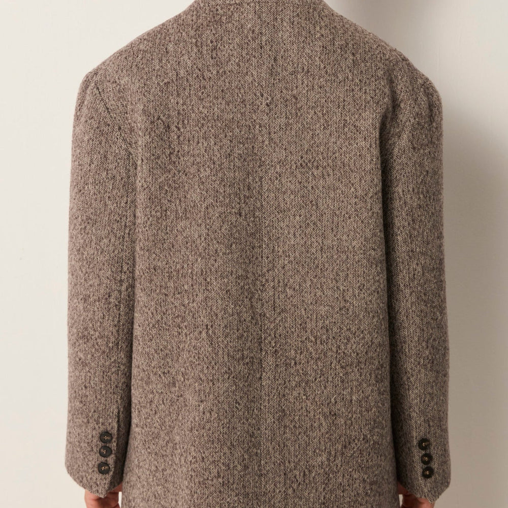 
                      
                        Back view of a person wearing a wool blazer jacket
                      
                    