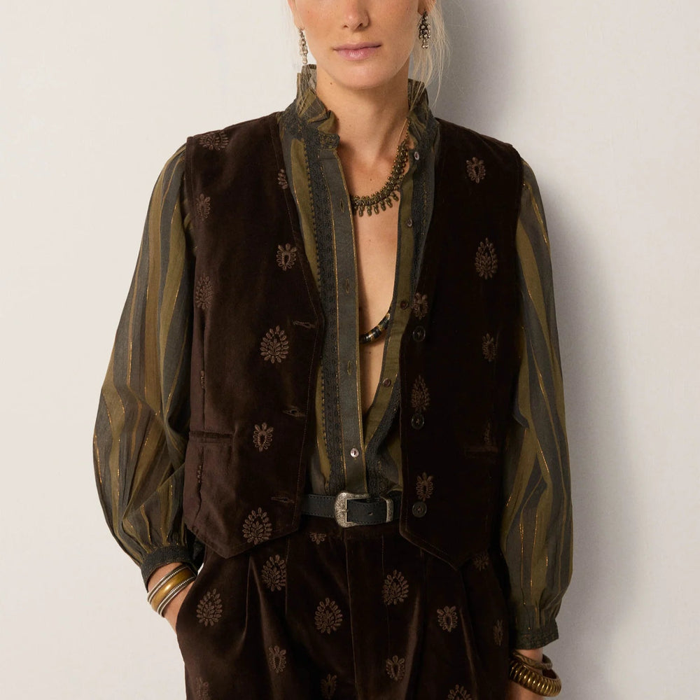 A woman wearing the Velluto Macchiato Kafka Vest by Maison Hotel 