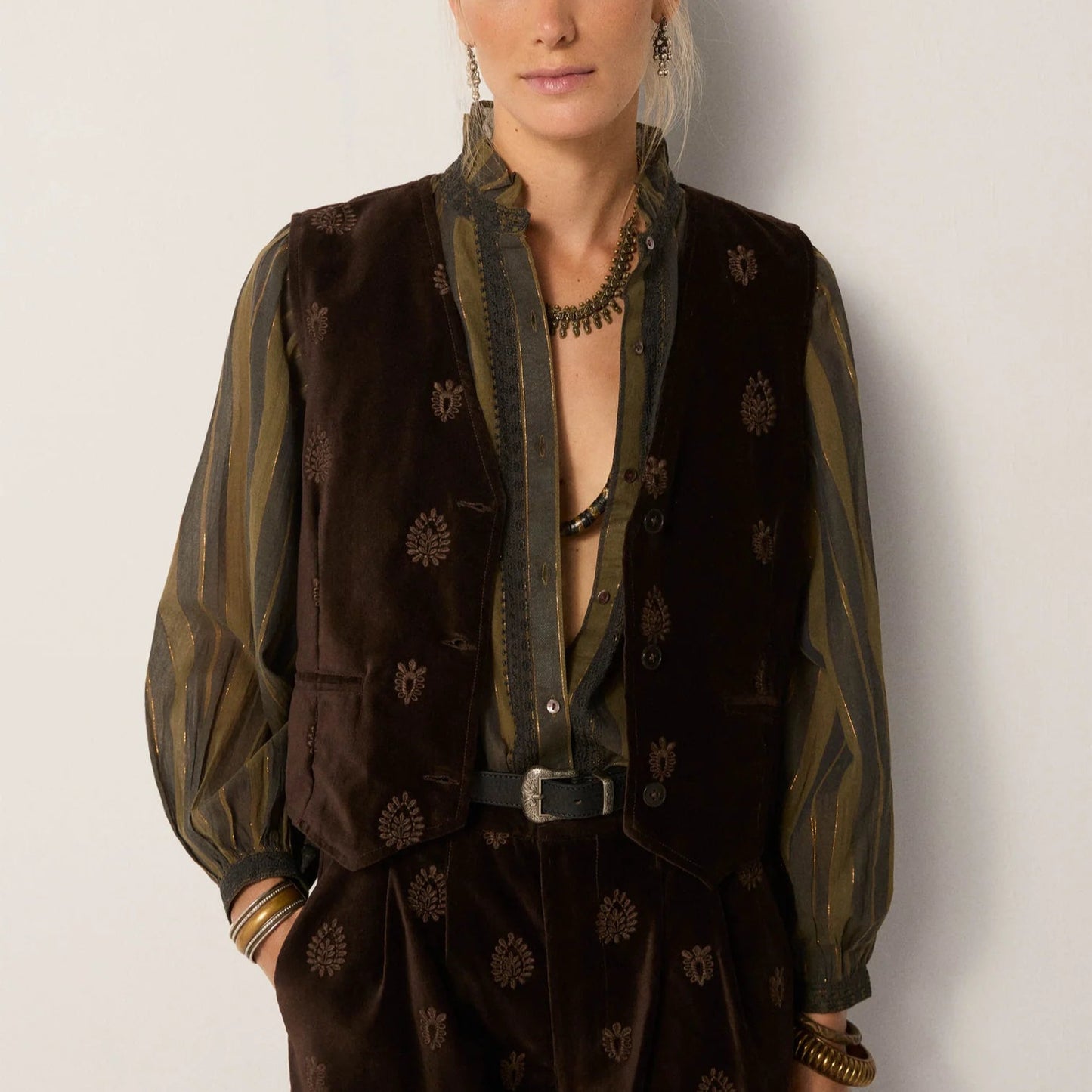 A woman wearing the Velluto Macchiato Kafka Vest by Maison Hotel 