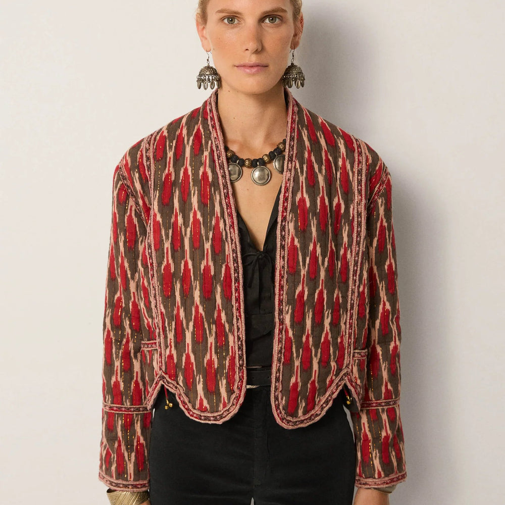 A woman wearing the Maison Hotel Devendra Jacket by Maison Hotel