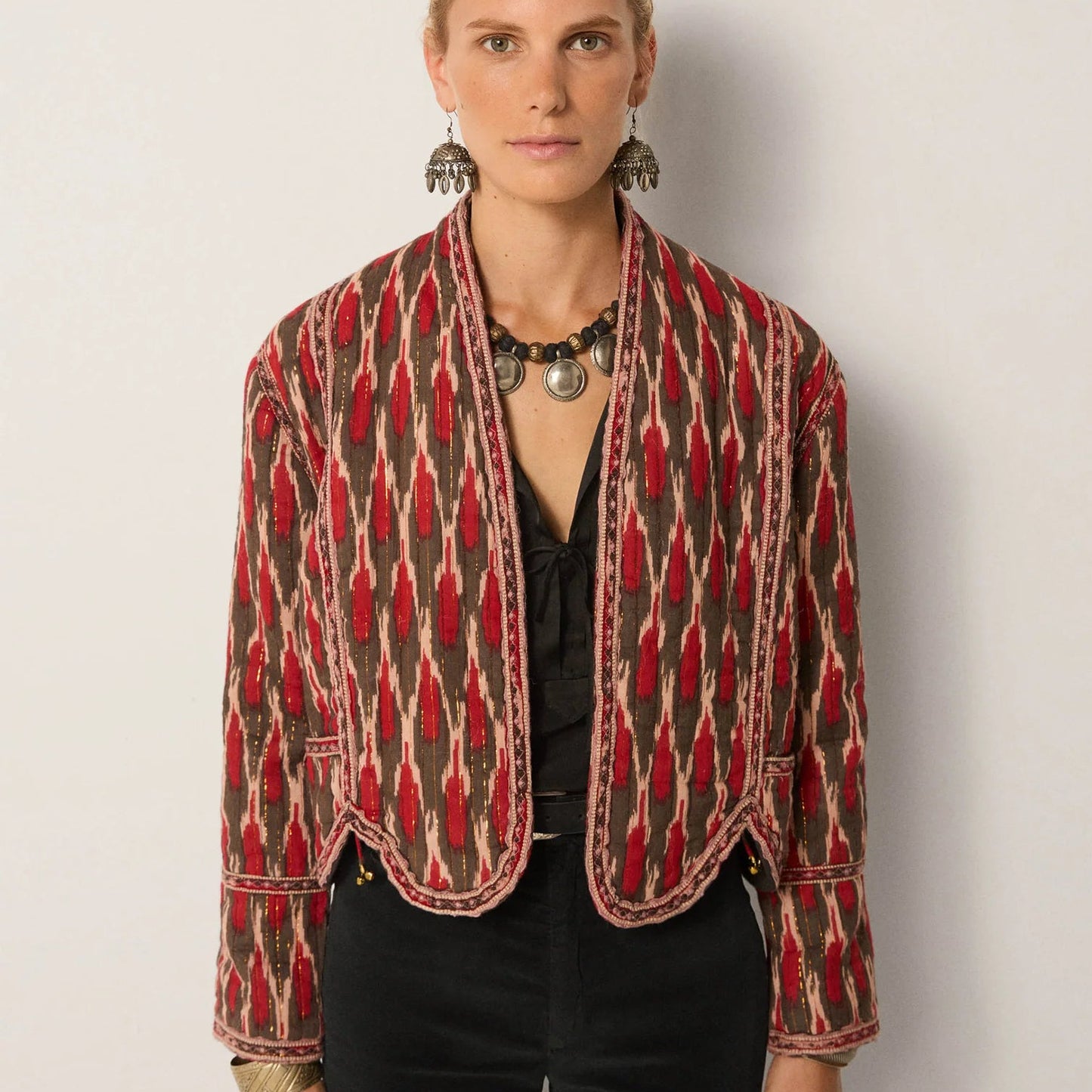 A woman wearing the Maison Hotel Devendra Jacket by Maison Hotel