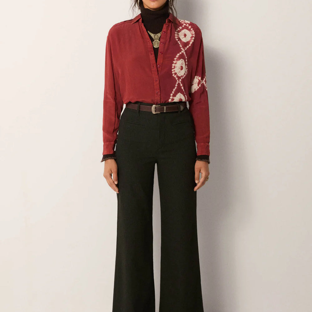 
                      
                        Woman wearing a red patterned button down blouse tucked into the Ash Heritage Carlo Pant by Maison Hotel
                      
                    