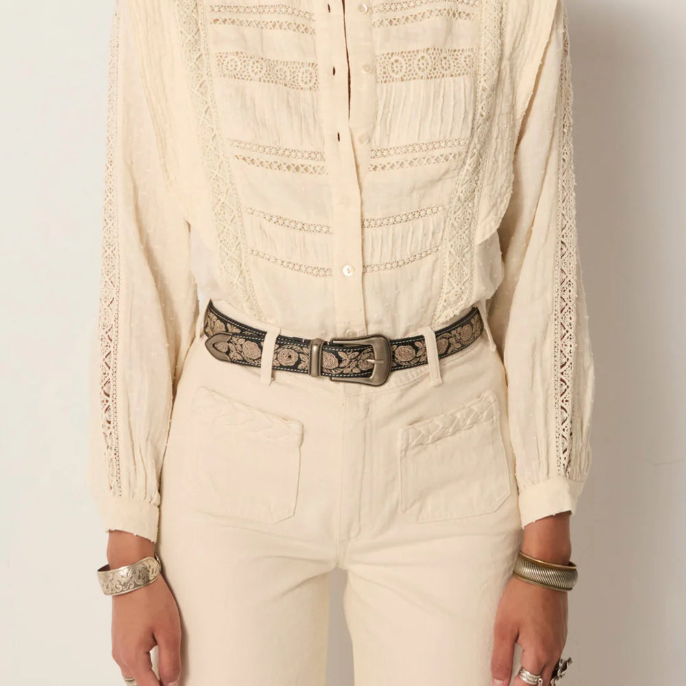 
                      
                        A woman wearing the Mariachi Onix Guadalupe leather belt by Maison Hotel
                      
                    