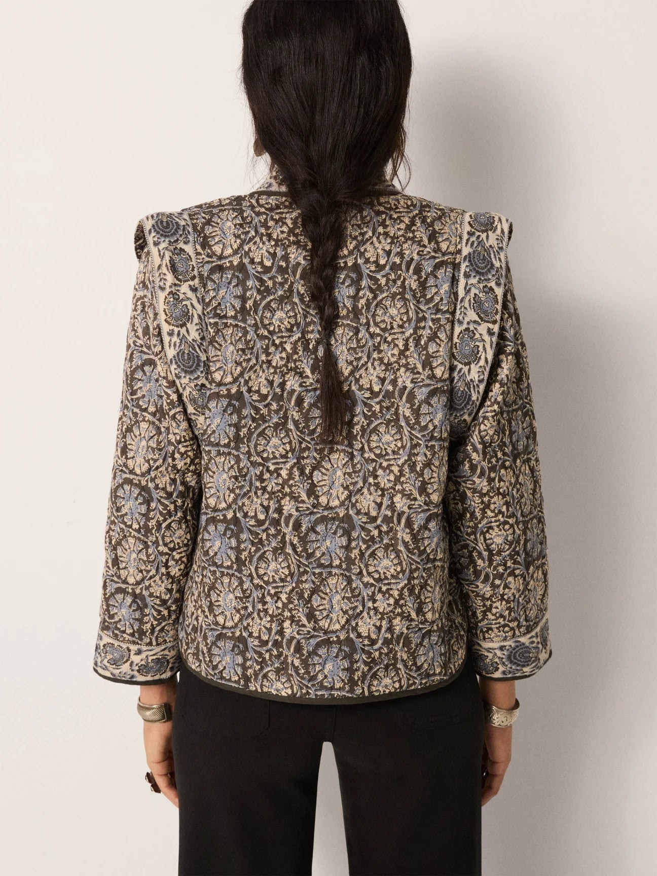Woman wearing a patterned jacket with soft structure from Maison Hotel