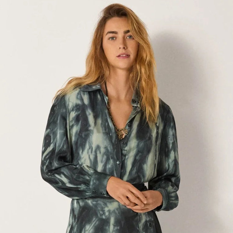 A woman wearing the Noelia Blouse by Maison Hotel