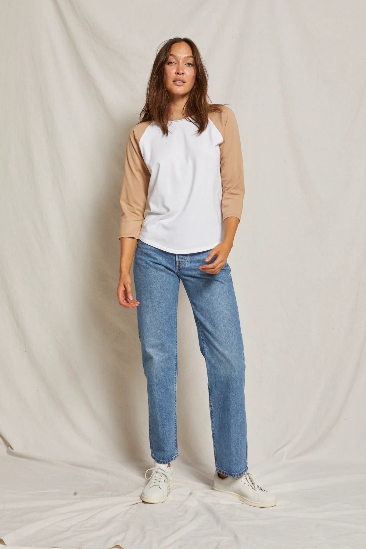 Woman wearing a tan and white raglan tee from Perfect White Tee