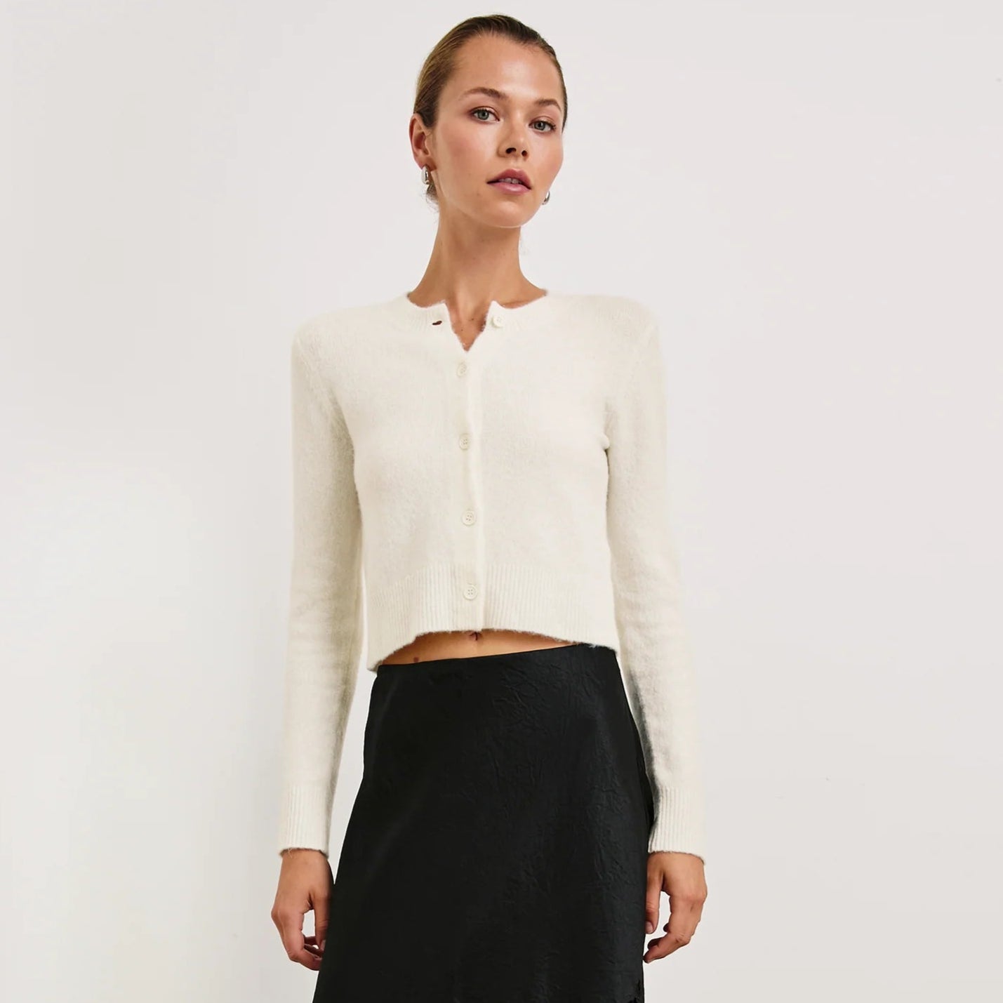 A woman wearing the Ivory Matilda Sweater from Rails