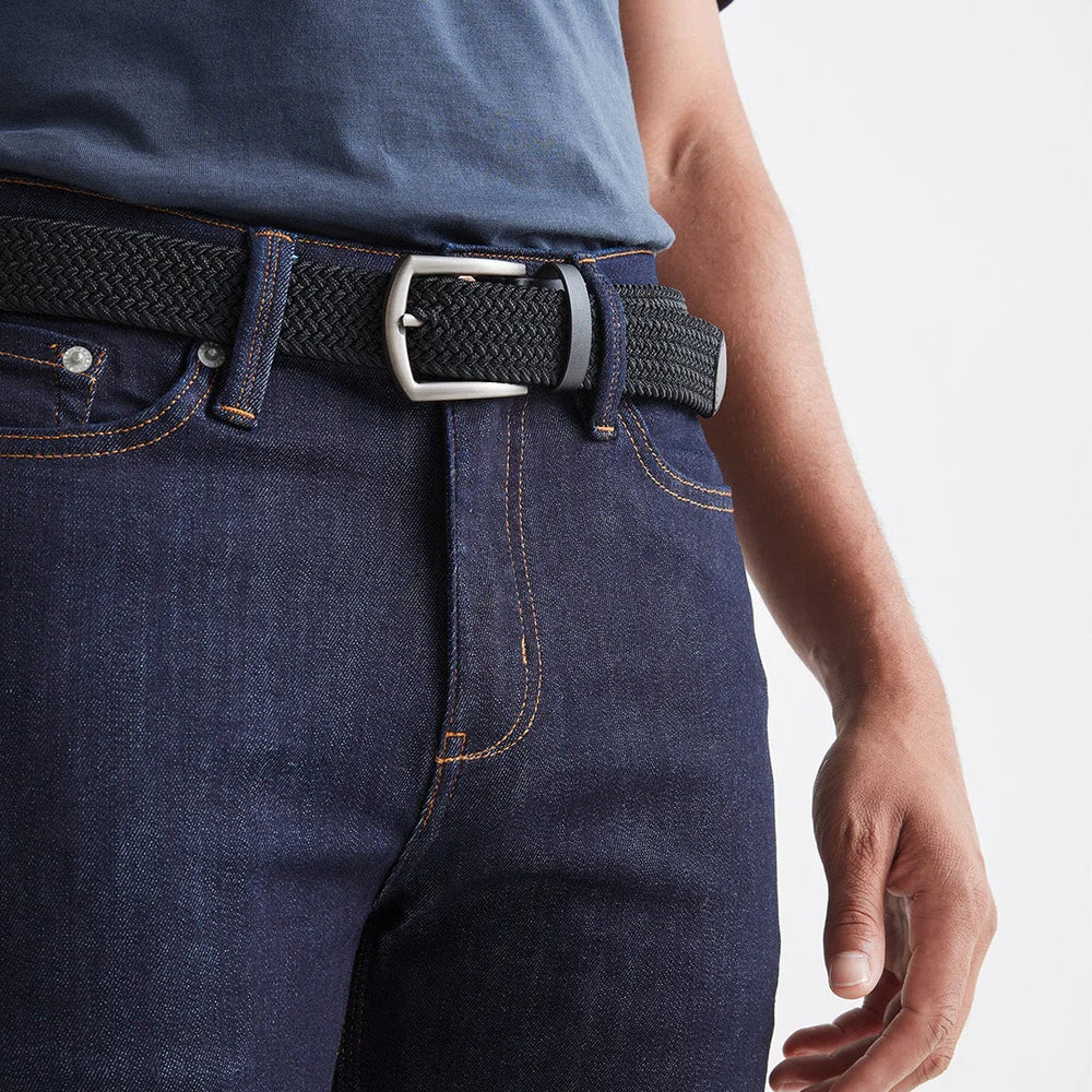 
                      
                        Front detail on the Black Performance Stretch Belt by DU/ER
                      
                    