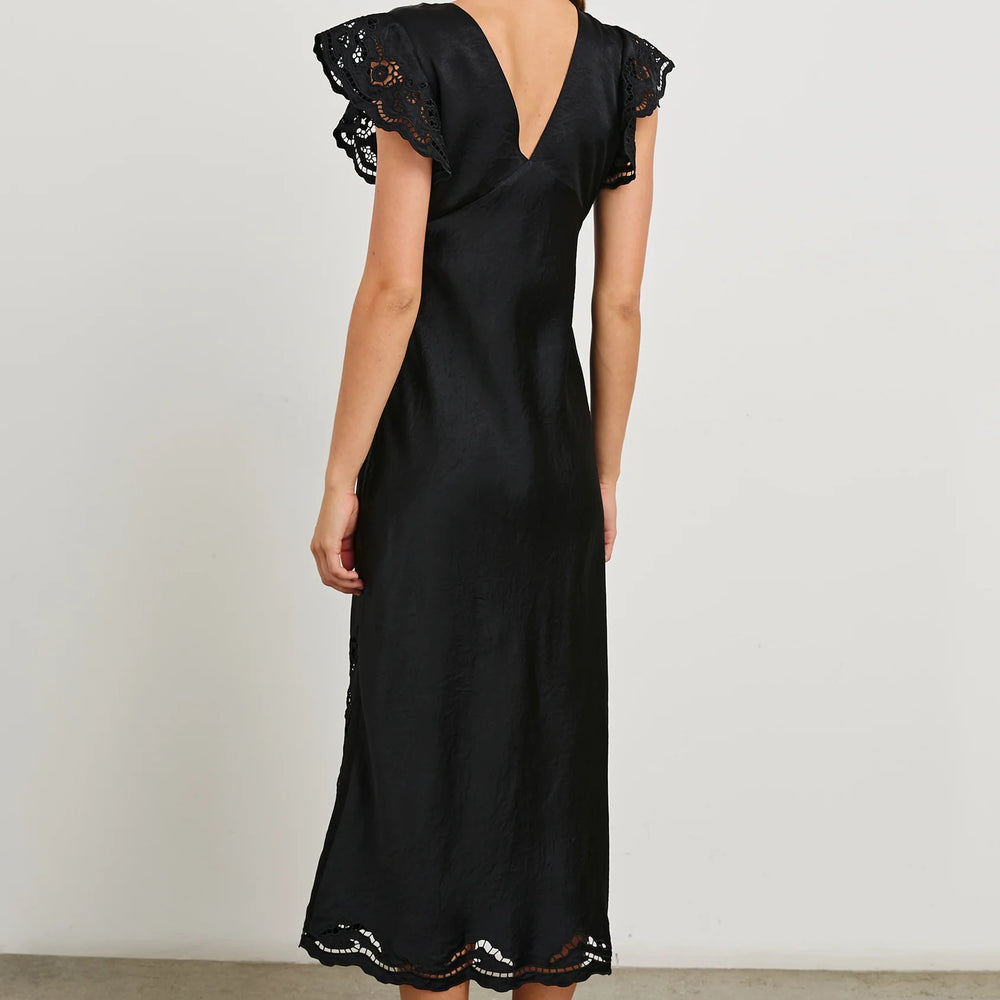 
                      
                        Back view of a woman wearing the Black Eyelet McKenna Satin Midi Dress by the brand Rails
                      
                    