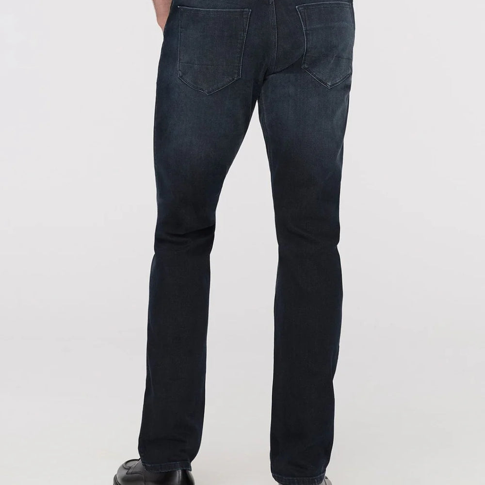 
                      
                        Man wearing dark blue DUER jeans
                      
                    