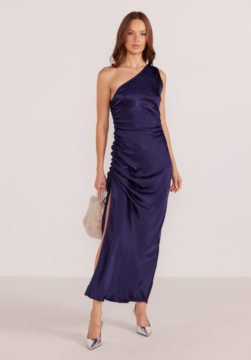 MINKPINK's Lumina Midi Dress offers a one shoulder design with ruched side seams and an adjustable tie detail