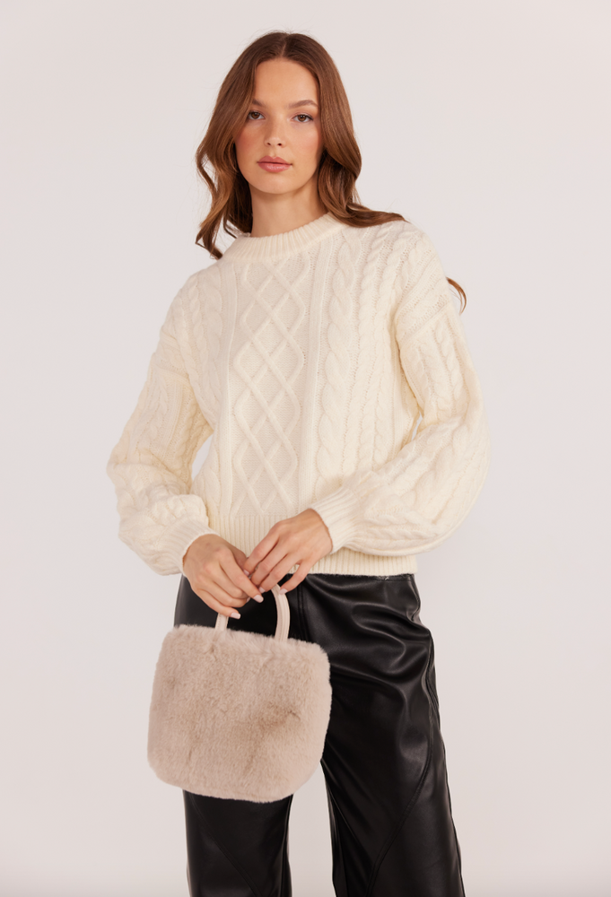 This classic cable knit sweater from MINKPINK is a versatile cold weather staple you'll enjoy for seasons to come.