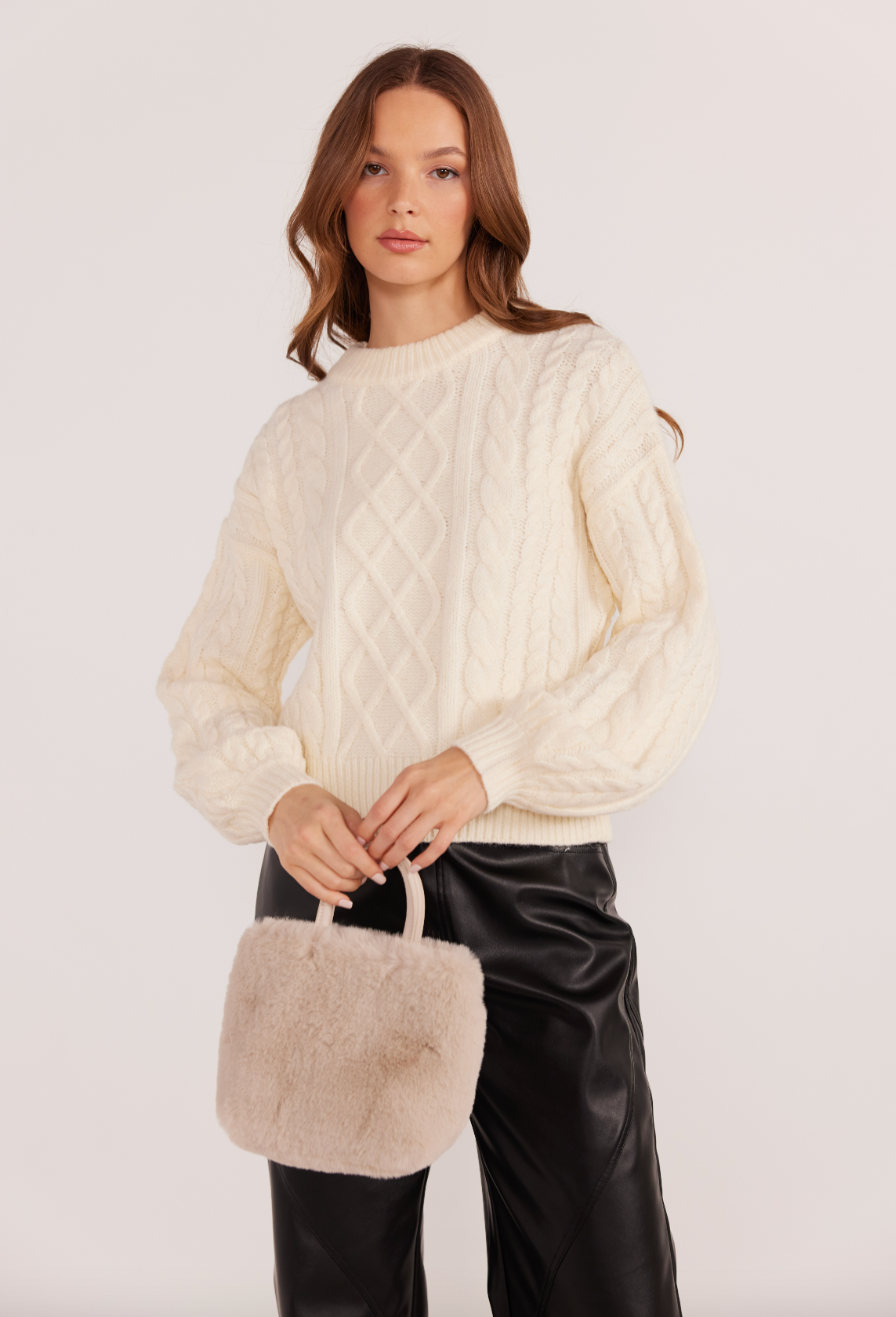 This classic cable knit sweater from MINKPINK is a versatile cold weather staple you'll enjoy for seasons to come.