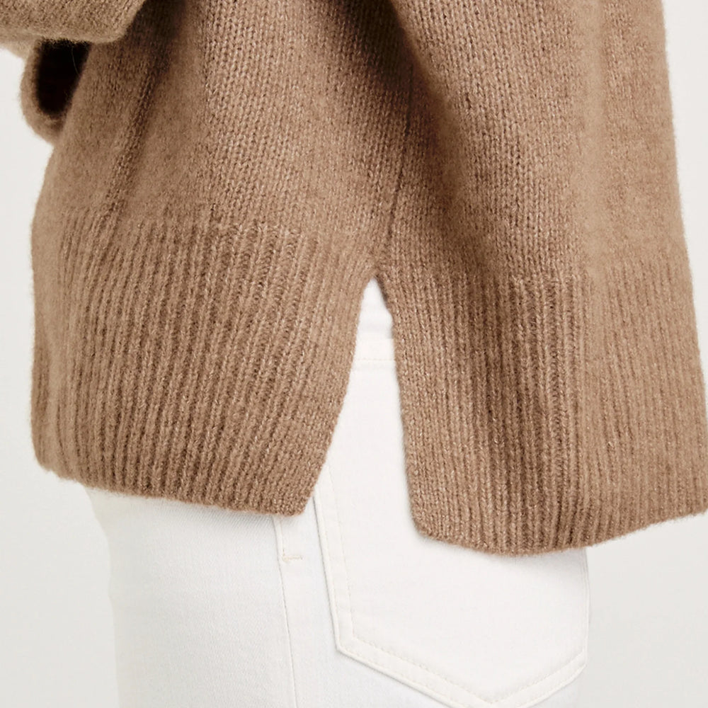 
                      
                        This sweater offers ribbed trims and side vent details
                      
                    