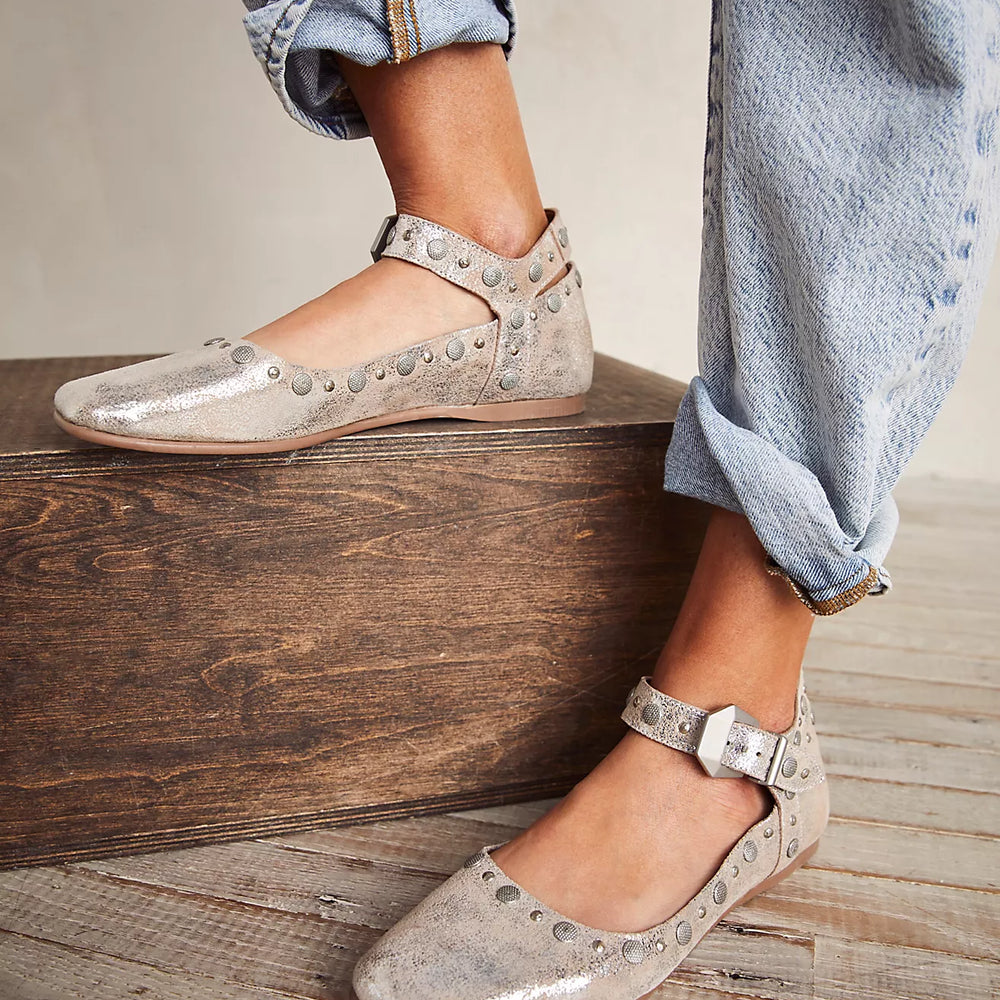 
                      
                        These Free People flats feature an adjustable ankle strap, cool studded details, and a classic round toe.
                      
                    