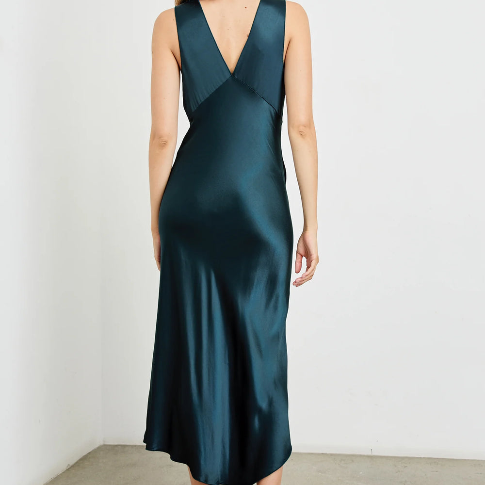 
                      
                        Back view of a woman wearing the Monique Midi Slip Dress in the color Deep Sea by the brand Rails
                      
                    