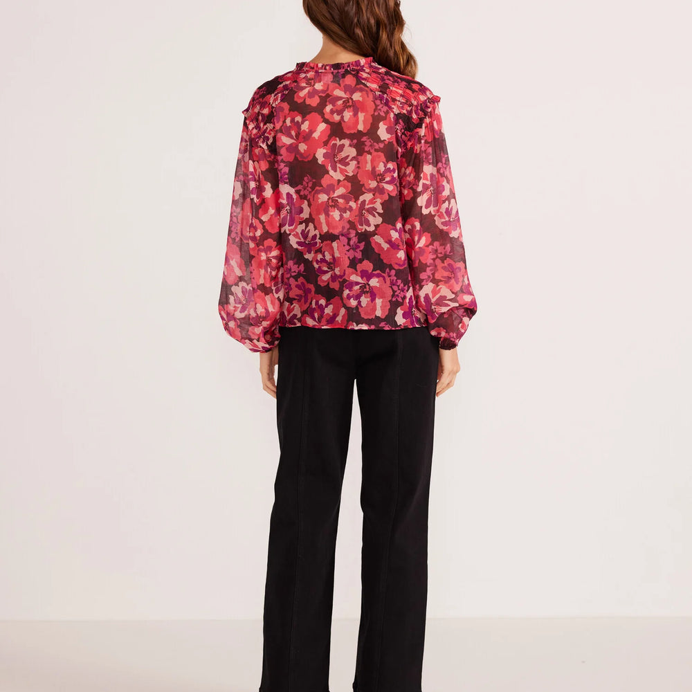 Back view of the painterly blouse by Minkpink