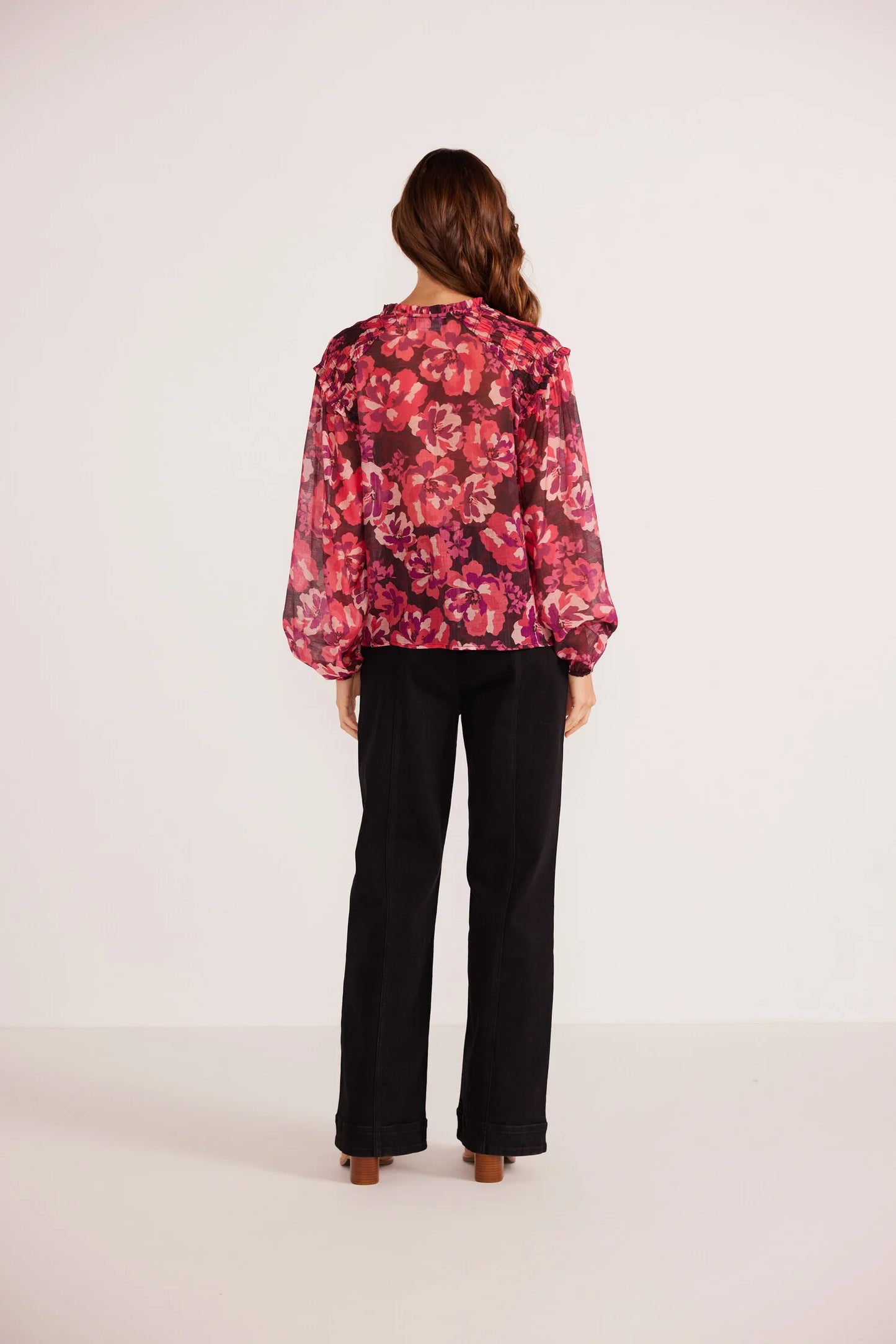 Back view of the painterly blouse by Minkpink