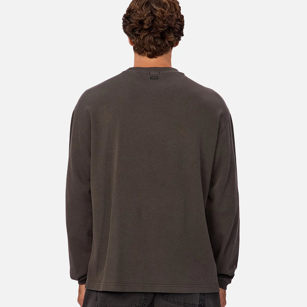 
                      
                        A man wearing a dark grey long sleeve shirt from Industrie
                      
                    