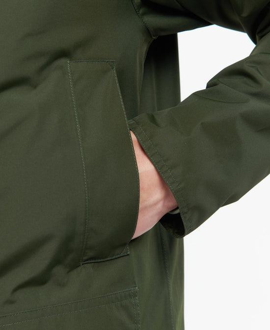 Hand warmer pocket view of the green Hooded Domus Jacket by Barbour