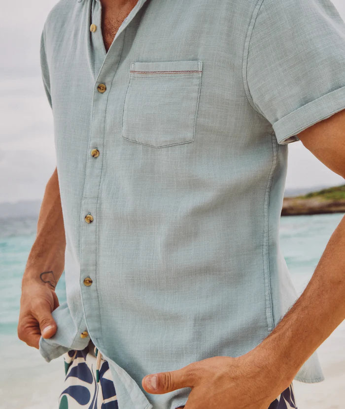 
                      
                        Side view of the Marine Layer Men's Stretch Selvage Short Sleeve Shirt in the color Pale Blue
                      
                    