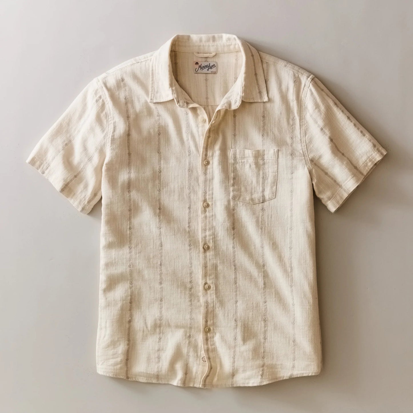 Marine Layer Men's Stretch Selvage Short Sleeve Shirt in Cream Embroidery, now available at Harbour Thread men's store