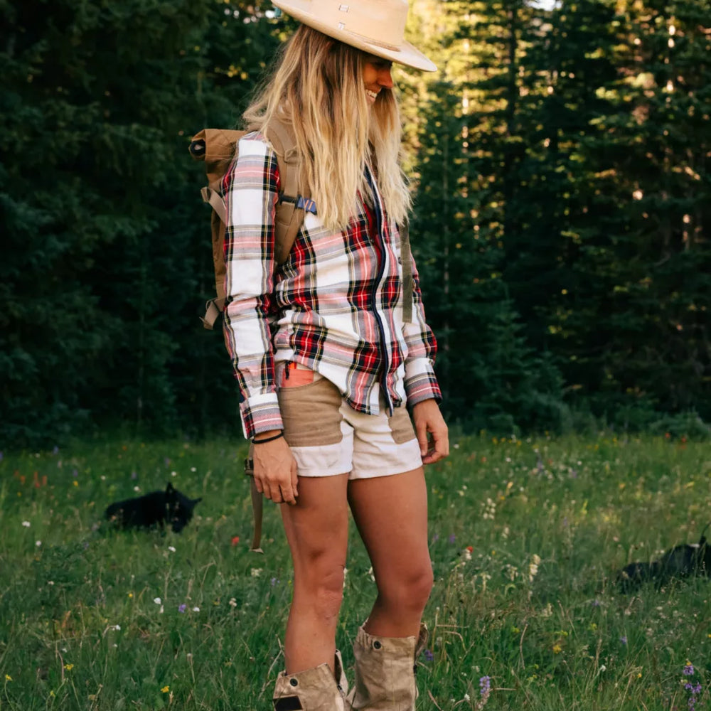 Woman outside wearing the Offwhite and Tan or 5Incher Women's Field Shorts by Amundsen Sports