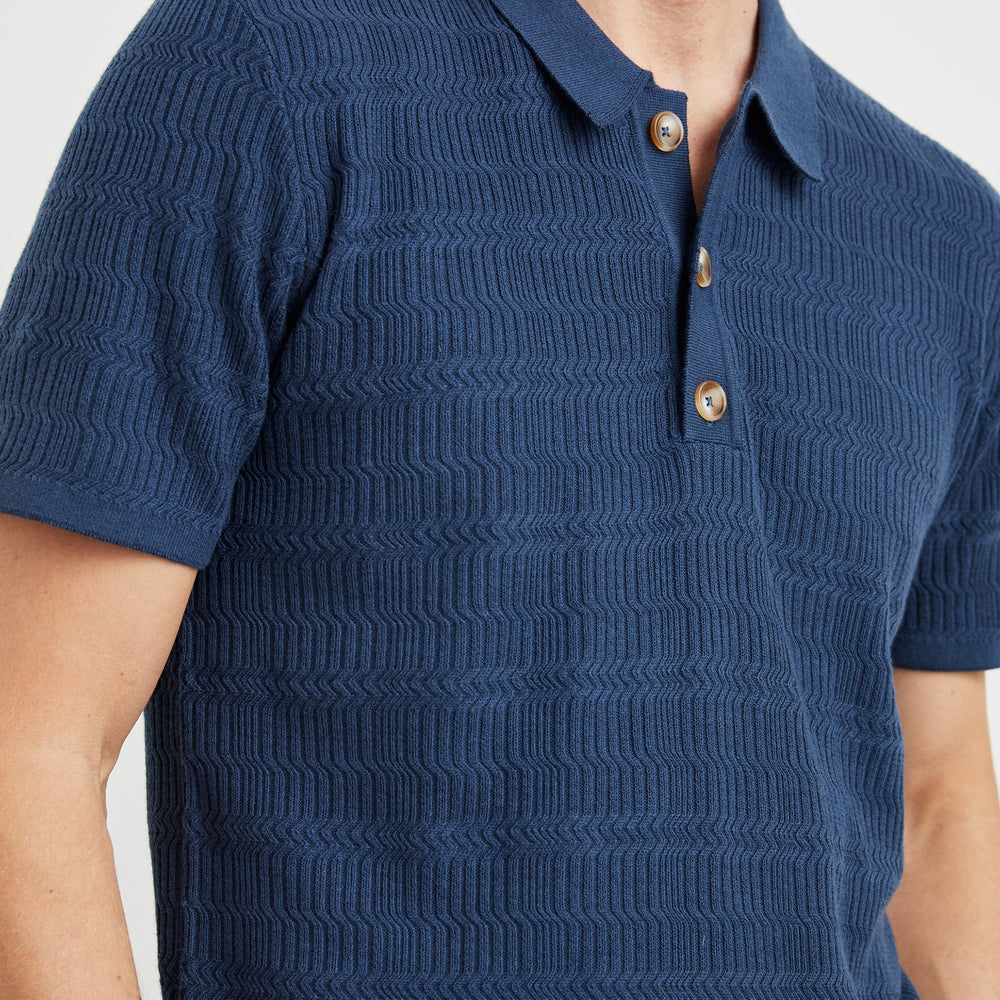 
                      
                        Textured jacquard men's blue polo shirt
                      
                    