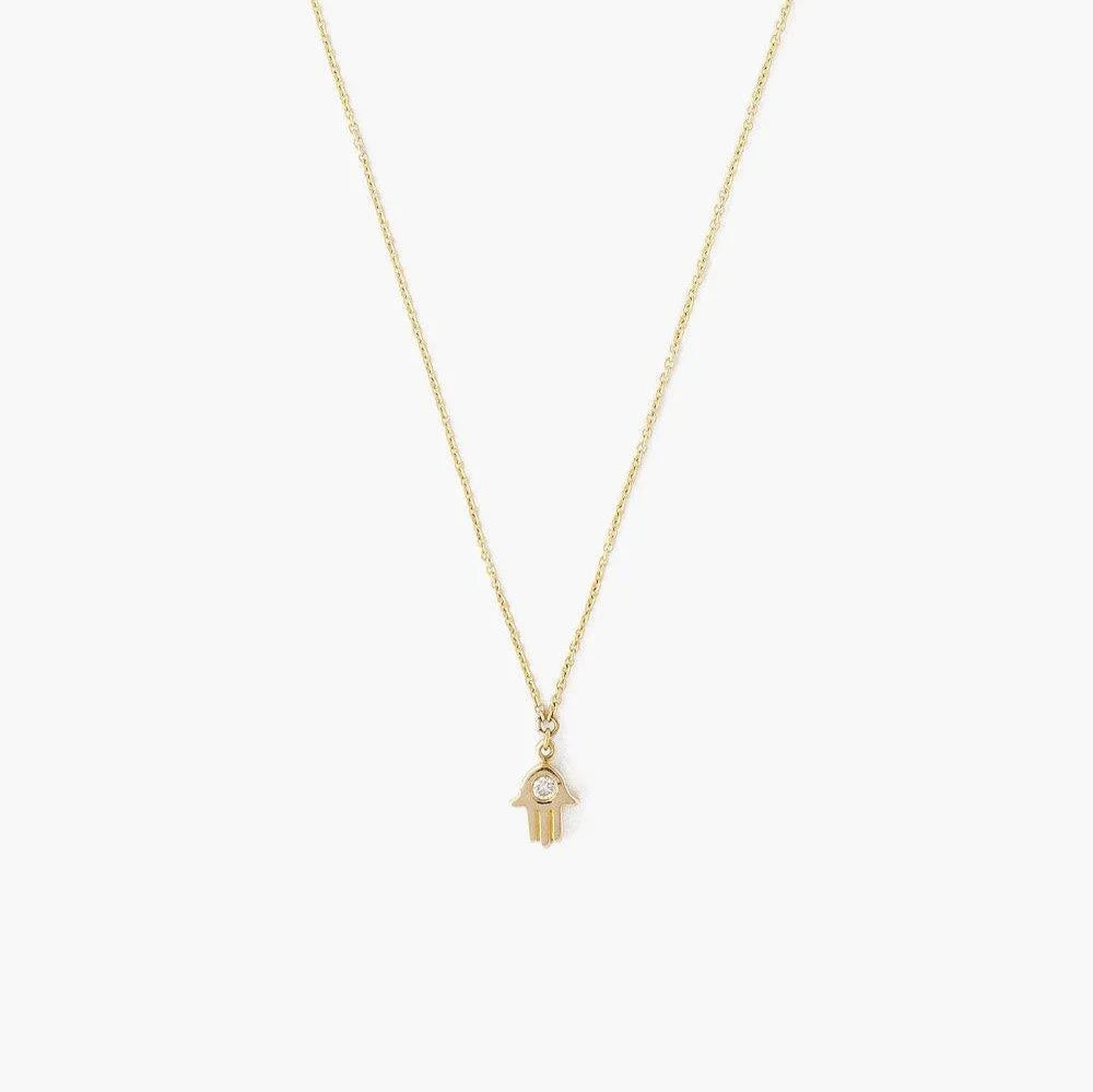 Detail on Chan Luu's 14K Gold Hamsa Necklace with Diamond Inlay