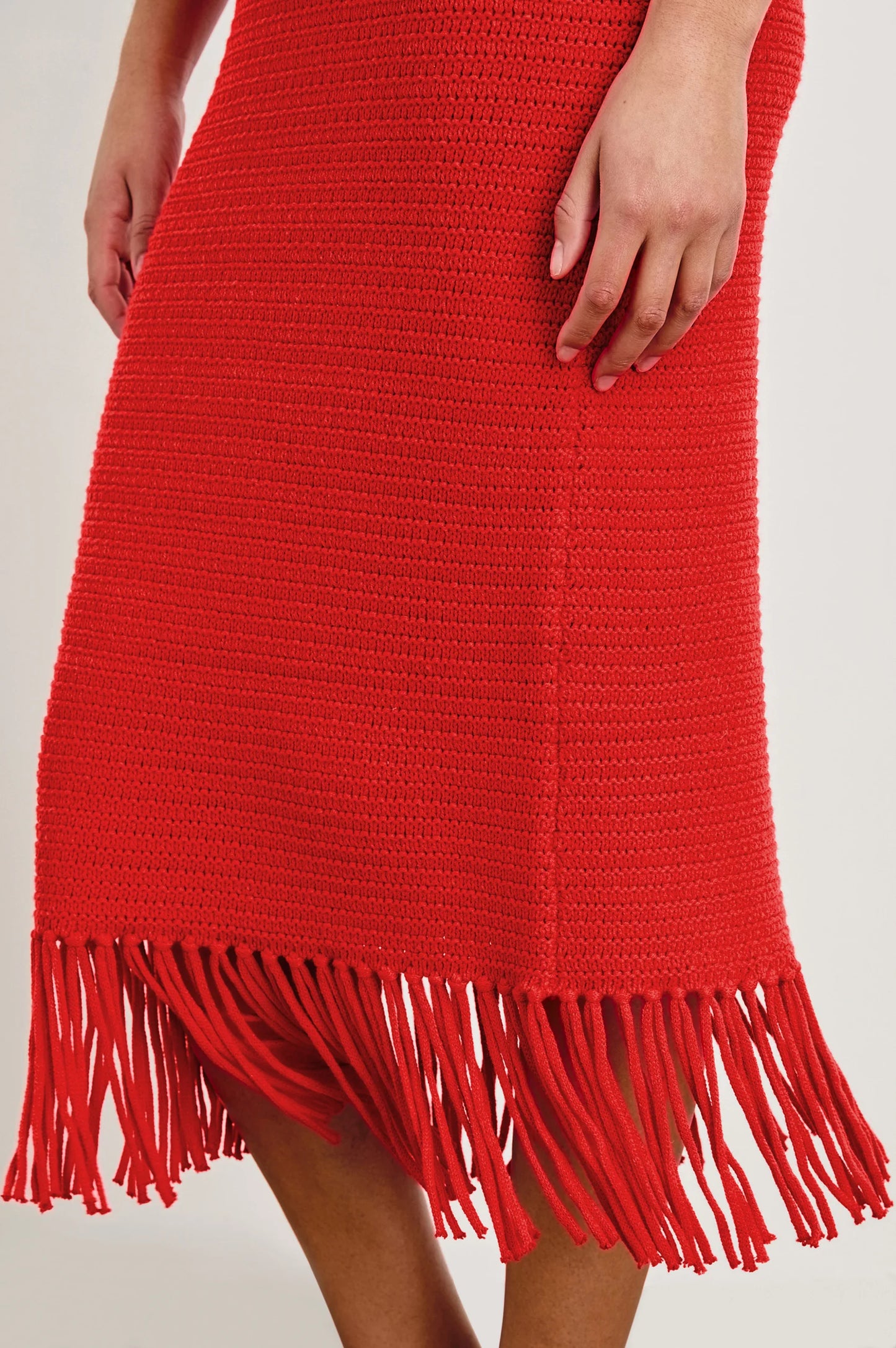 Red knit midi dress with fringed bottom hem
