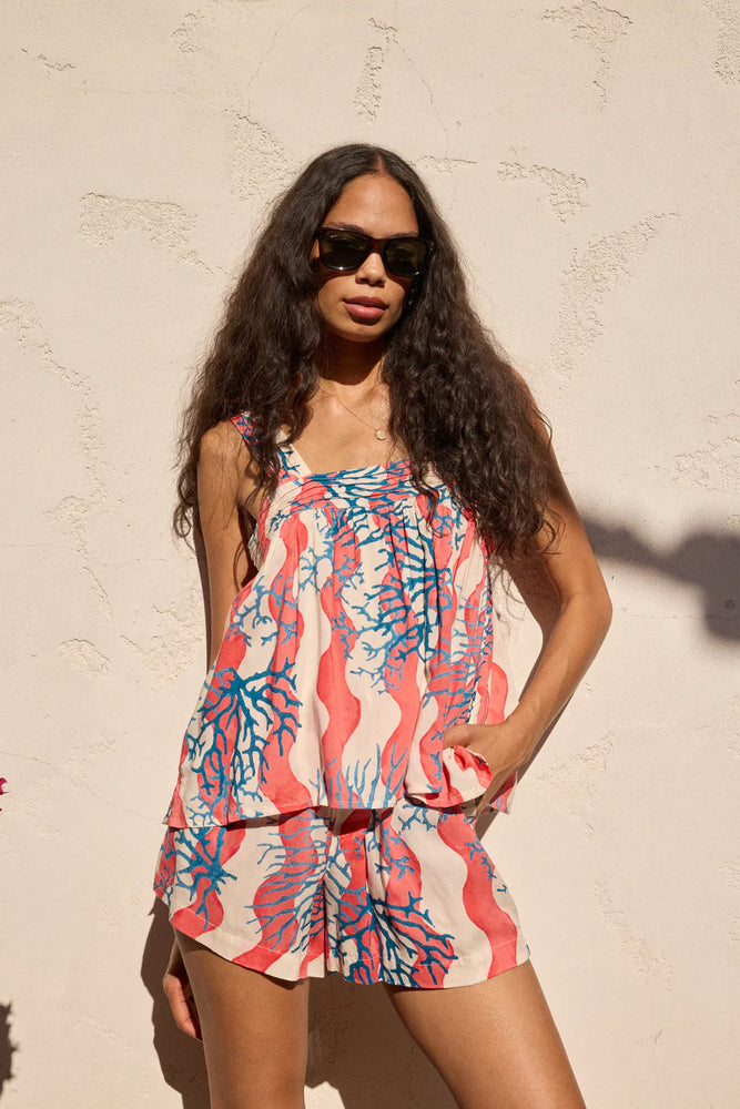 
                      
                        Be resort-ready with the Coral Wave Peach Jasper Shorts by Natalie Martin
                      
                    
