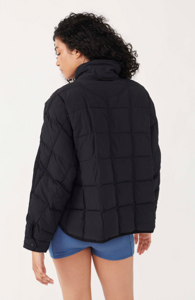 
                      
                        Back view of a woman wearing the Pippa Packable Black Puffer Jacket by Free People
                      
                    