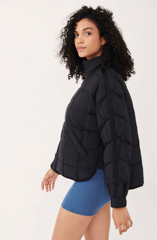 
                      
                        Side view of a woman wearing the Pippa Packable Black Puffer Jacket by Free People
                      
                    