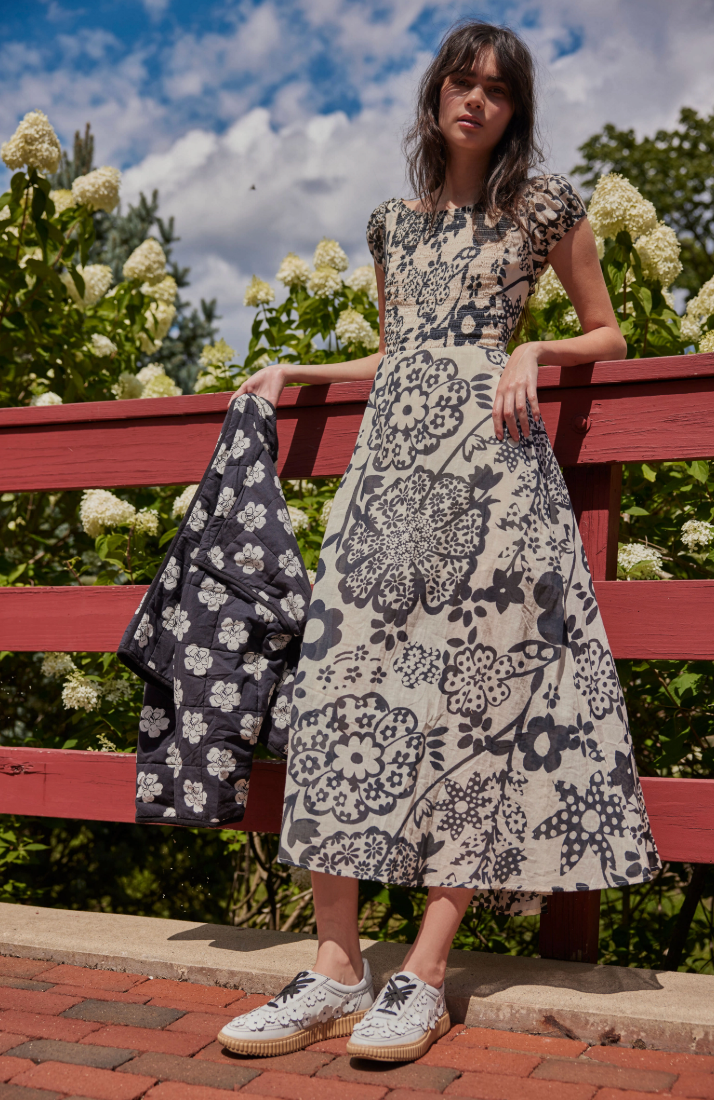 Free People's Ultraviolet Dress features a smocked top, puffed sleeves, and a striking strappy back. Shop this maxi dress at Harbour Thread Burlington.