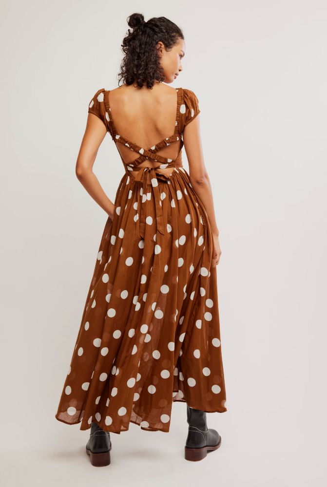 
                      
                        Women's polka dot strappy back dress from Free People. 
                      
                    