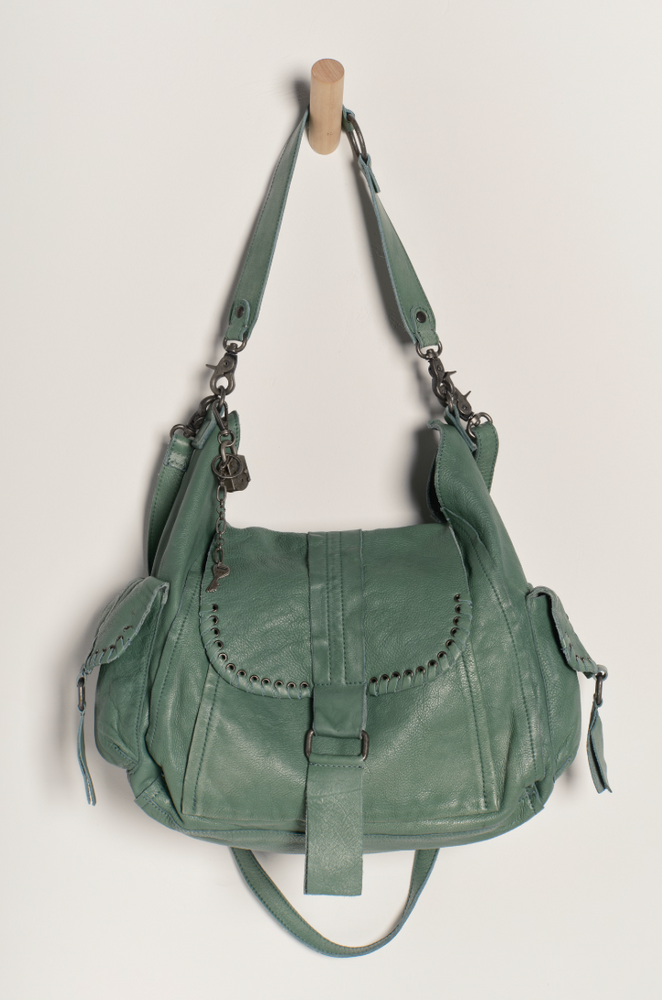 Enjoy multiple ways to wear this hobo-style leather tote bag from Free People. Shop yours at Harbour Thread boutique in Burlington, VT!