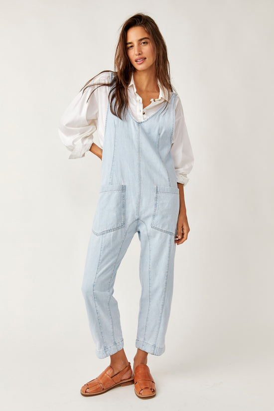 Front view of the light wash Free People High Roller Jumpsuit 