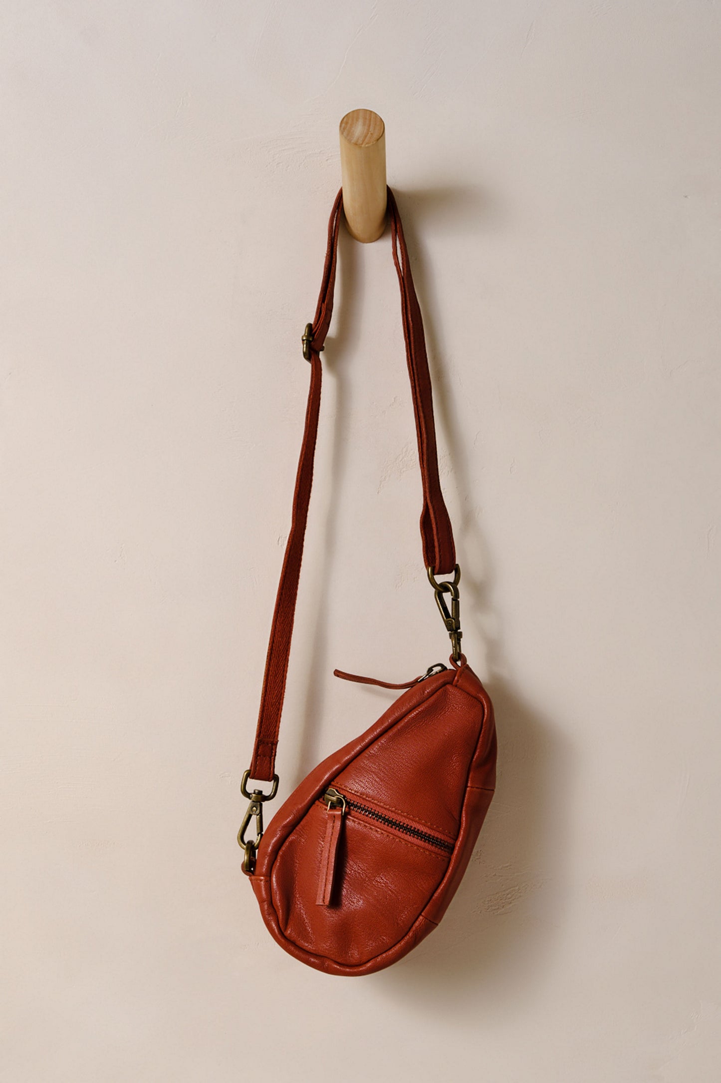 Free People's Coffee Date Mini Crossbody in the color Terracotta