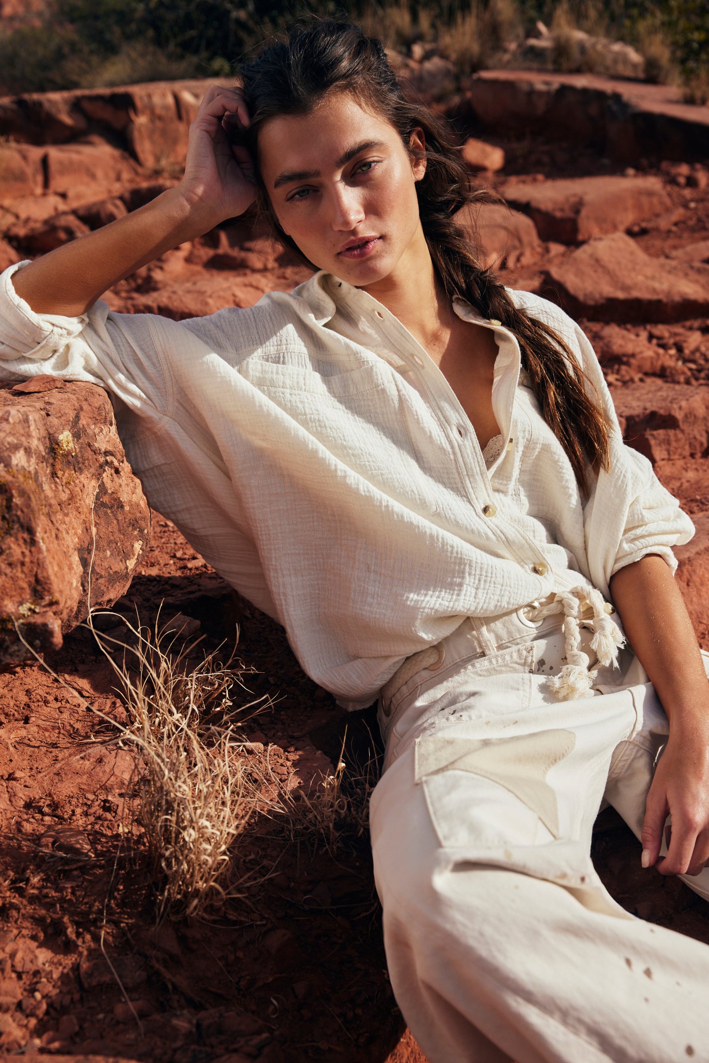 Woman wearing Free People's Optic White Cardiff Button Down Top