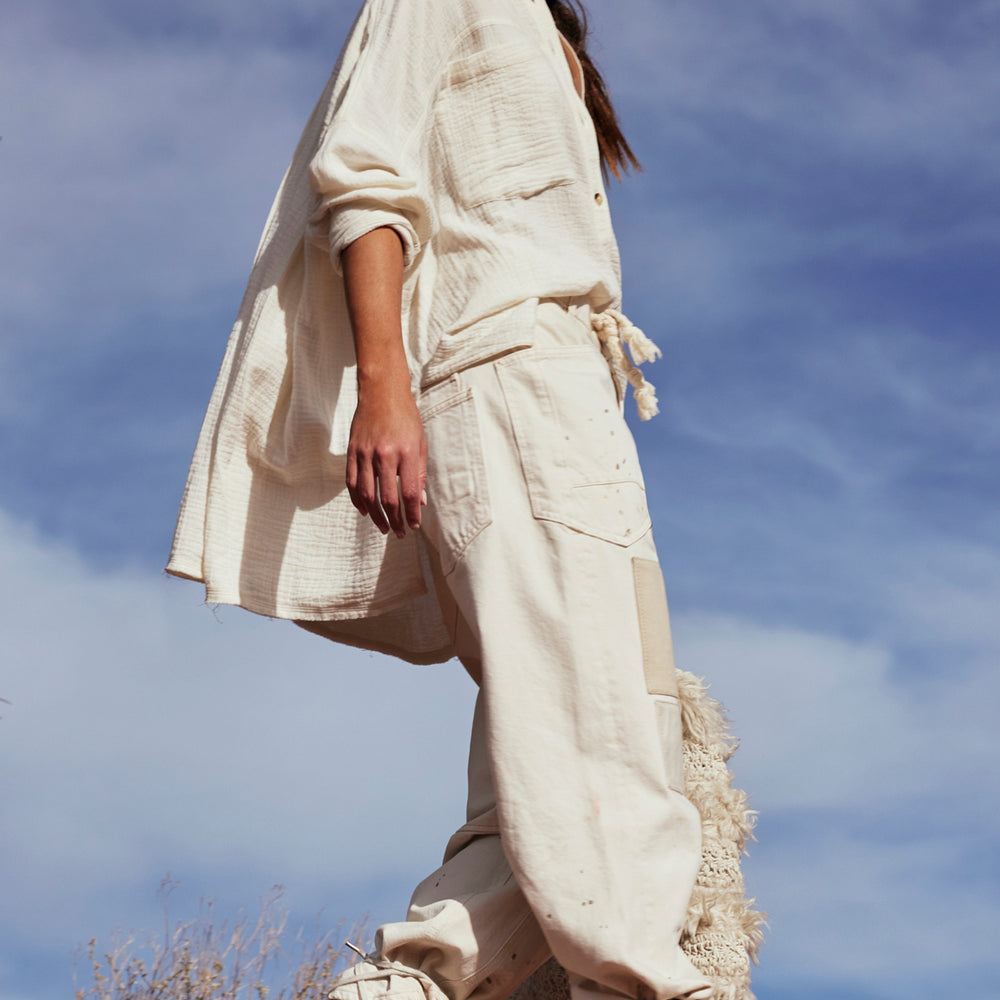 
                      
                        Woman wearing Free People's Optic White Cardiff Button Down Top
                      
                    