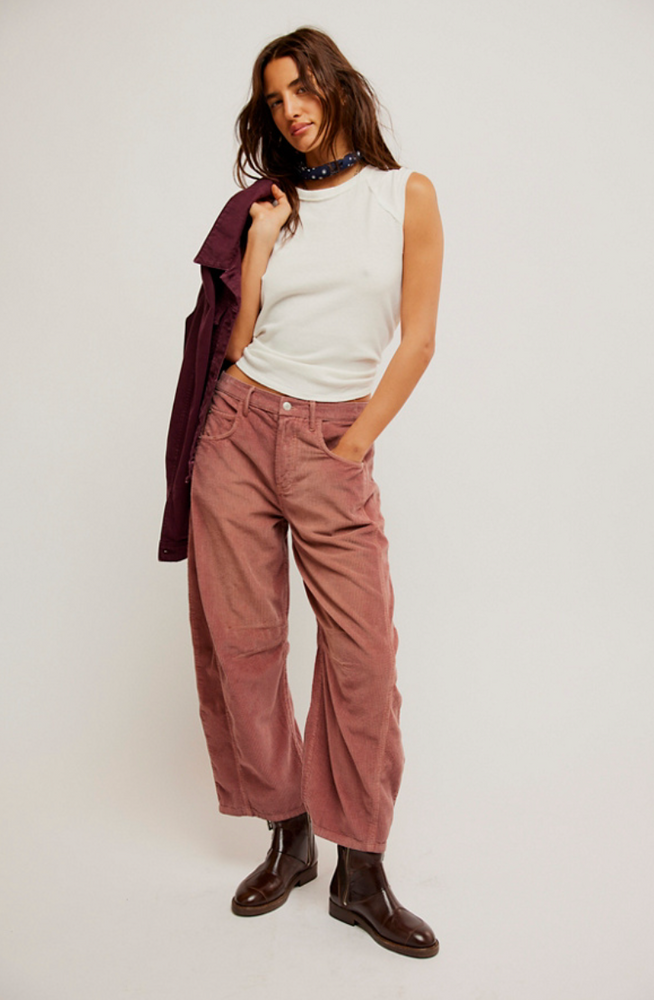 These pink cord barrel jeans from Free People offer belt loops at the waistband and 4-pocket styling