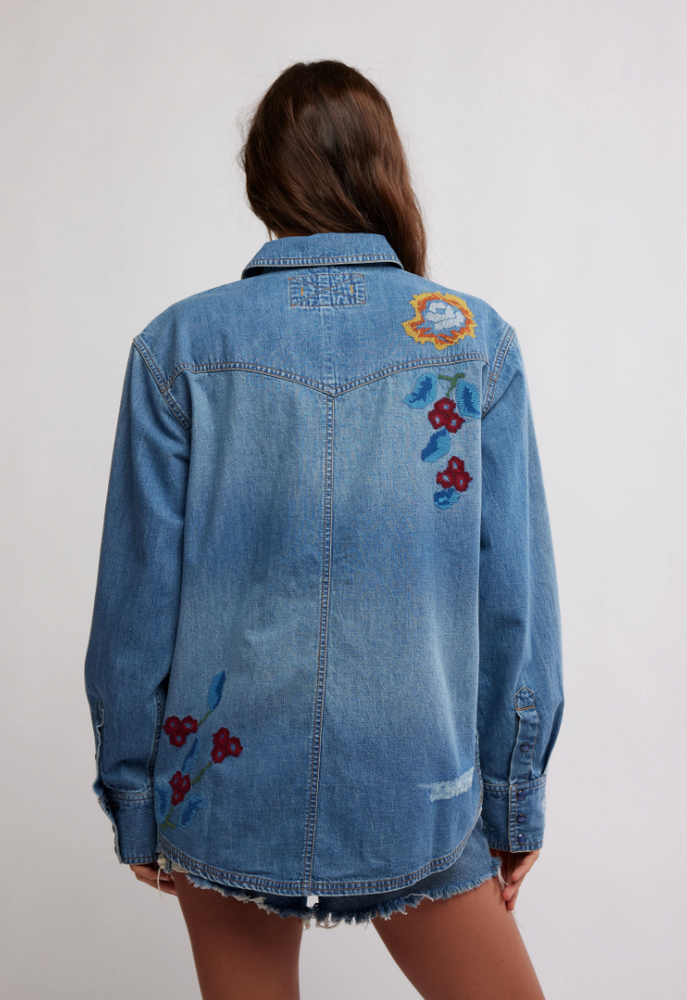 
                      
                        Women's oversized western-style denim shirt from Free People. 
                      
                    