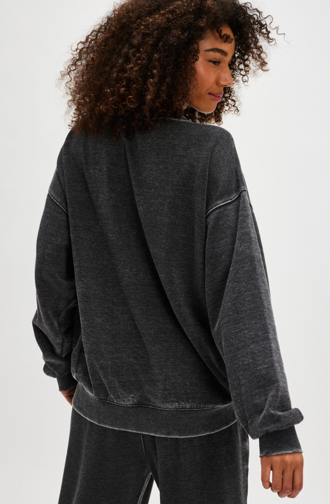 
                      
                        The black Slow It Down Pullover by Free People
                      
                    