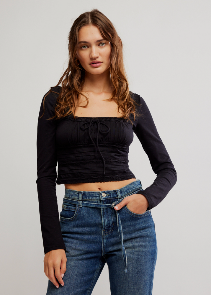 
                      
                        The Black Scarlet Smocked Long Sleeve Top by Free People is available at Harbour Thread. 
                      
                    