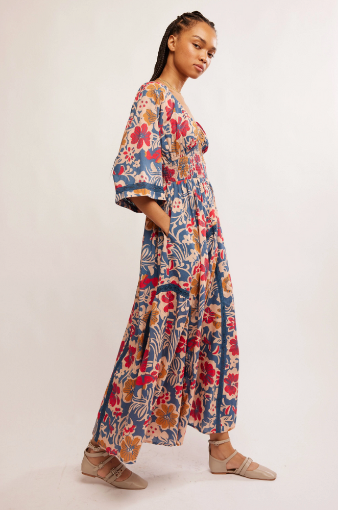 
                      
                        Women's floral maxi dress with exaggerated sleeves and side pockets. 
                      
                    