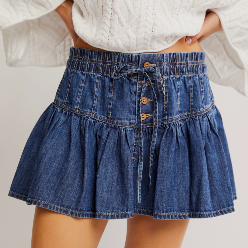 Women's medium blue denim mini skirt with exposed button closure