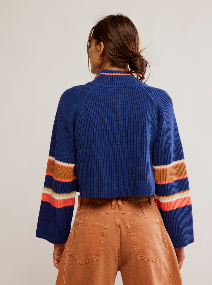 
                      
                        Women's blue cropped pullover with stripe details
                      
                    