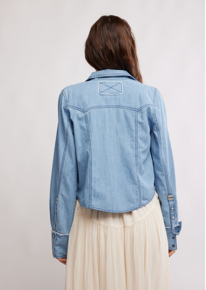 
                      
                        Women's faded light denim western style button up shirt
                      
                    
