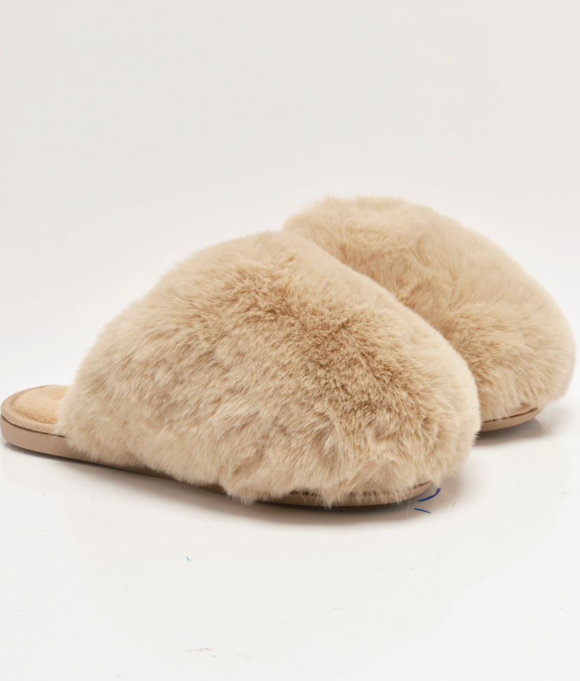 The Free People Snowball Slippers are available in Taupe Faux Fur at Harbour Thread boutique. 